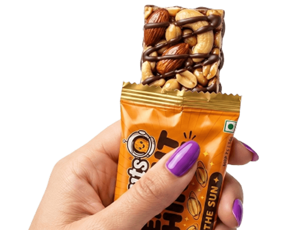 Hand holding a Planuts snack bar